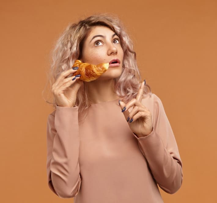 A woman with croissant
