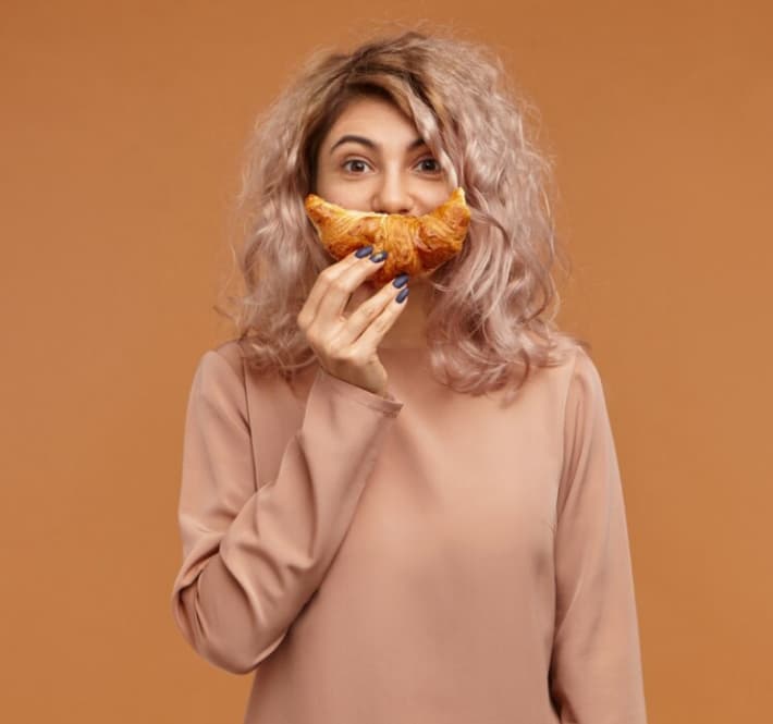 A woman with croissant